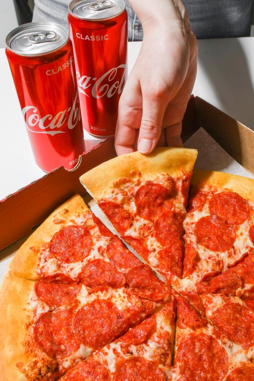 One topping pizza and two can soda pickup special